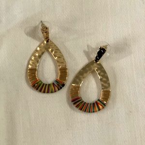 Gold dangle earrings with gold and rainbow thread.